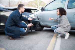 Two drivers arguing who should be held liable.